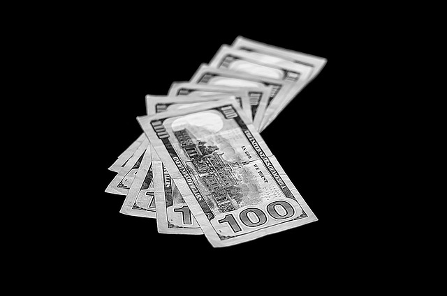 Picture of a pile of dollar bills.