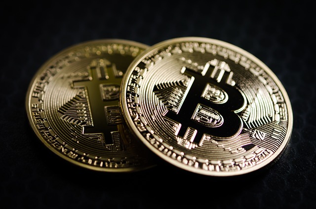 Bitcoin logo on two coins.